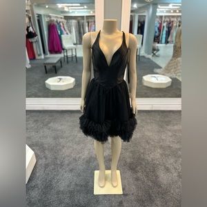 size 6. Black color. Halter top. flowy tulle bottom. Open back.